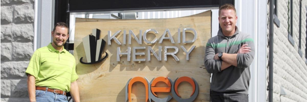 Kincaid Henry standing in front of the NEO Center