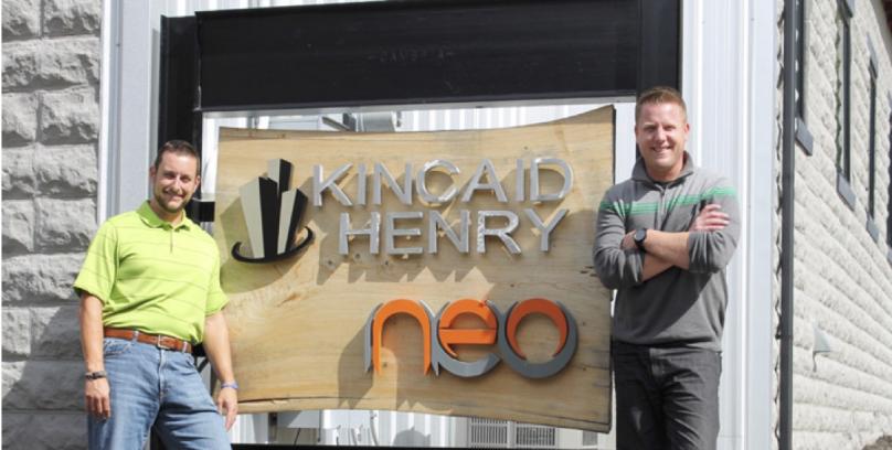 Kincaid Henry standing in front of the NEO Center